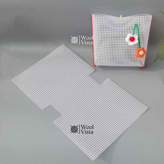 White pre-cut notched plastic mesh sheet next to a folded mesh pouch with crochet flower charms